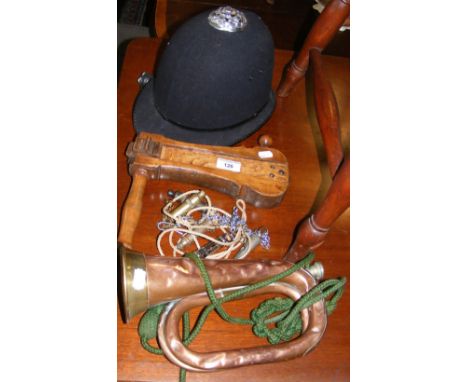 Policeman's helmet, bird scarer, bugle, etc.