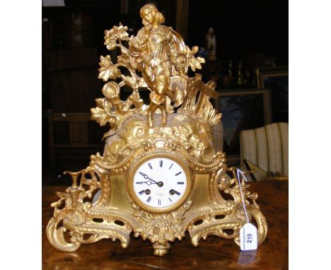 A French gilt striking mantel clock with silk suspension by Henry Marc, Paris - having figural surmount