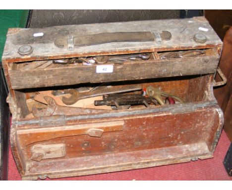 Old wooden tool chest containing selection of tools