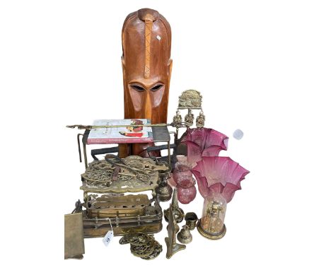 Large carved wood tribal mask, four ruby glass oil lamp shades, brass ware, etc.