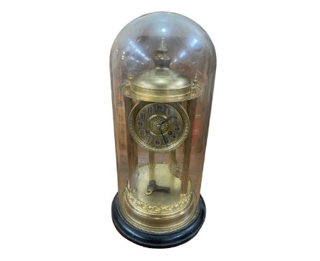 Ornate gilt metal mantel clock with glass dome and key, 45cm.
