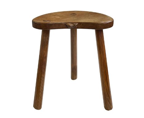 Robert Thompson of Kilburn 'Mouseman' kidney shaped milking stool, 45.5cm by 36.5cm by 29cm.