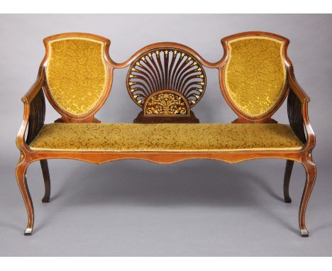 A late Victorian inlaid mahogany show-wood sofa, with shaped back and arms, upholstered gold velour, on four cabriole legs, 1
