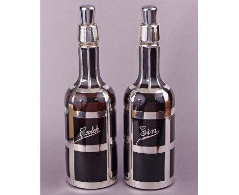 A pair of ruby glass bottle-shaped decanters with silver-overlaid strapwork &amp; inscribed “Scotch” &amp; “Gin”, engraved ma