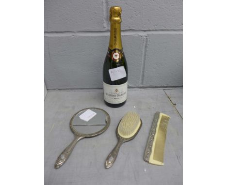 A bottle of Pierre Darcys champagne, a plated mirror, brush and comb 