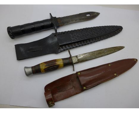 A sawback dagger with leather scabbard and a scout knife with leather scabbard 