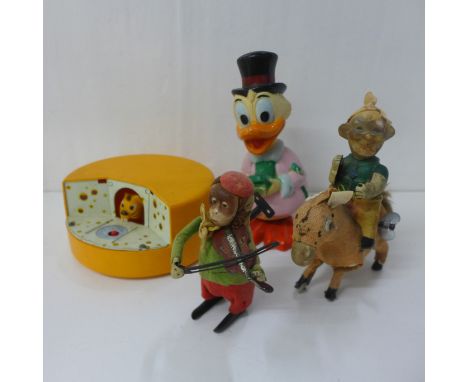 A clockwork monkey violin player and other vintage toys 