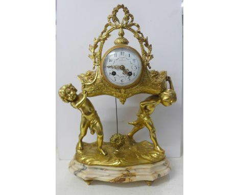 A French gilt metal ormolu and marble mantel clock, dial marked Charlet