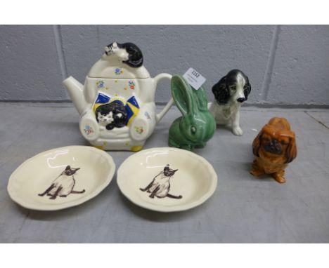 A Royal Doulton Pekinese, Sylvac dog, Bourne Denby rabbit, a pair of Siamese cat dishes and a novelty cat teapot&nbsp;**PLEAS