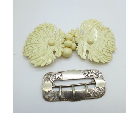 A silver buckle, 27g and a vintage Lucite buckle 