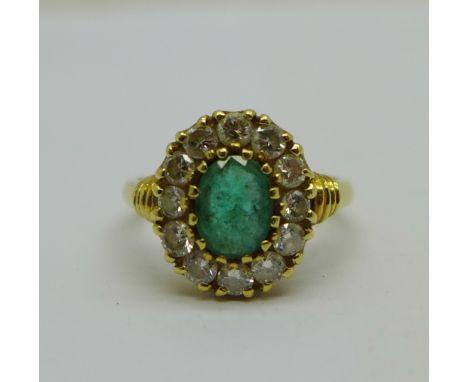 An 18ct gold, twelve stone diamond and emerald ring, 5.3g, P 