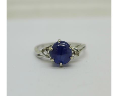 A 14k white gold and blue stone ring, 2.8g, O 