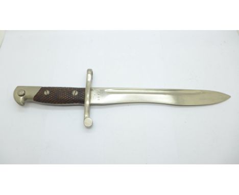 A Spanish bayonet and scabbard, matching serial numbers, the blade marked Toledo 