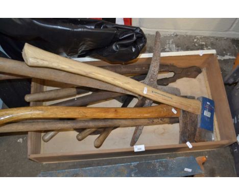 Quantity of assorted hand tools to include axes, pick axes shears and others