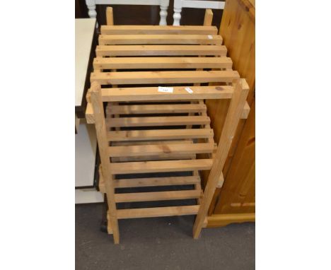 A pine slatted three tier shelf rack