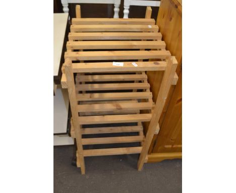 A pine slatted three tier shelf rack