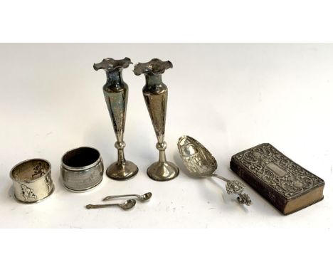 A chased silver napkin ring; a 925 silver napkin ring; a pair of white metal spill vases with Chinese marks; and a Hymns Anci