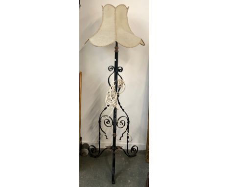 A wrought iron standard lamp, with shade 