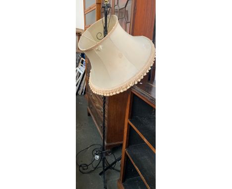 A wrought iron standard lamp with shade, height to top of fitting 170cmH 