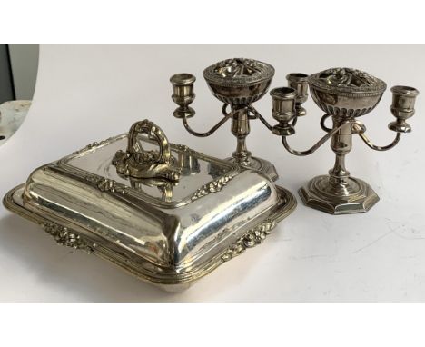 Three silver backed clothes brushes, one by Mappin &amp; Webb; together with a pair of plated candlesticks, and a plated entr