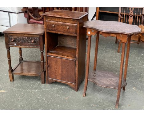 An oak bedside cabinet; carved oak occasional table with drawer; and a shaped occasional table with carved top and shelf 