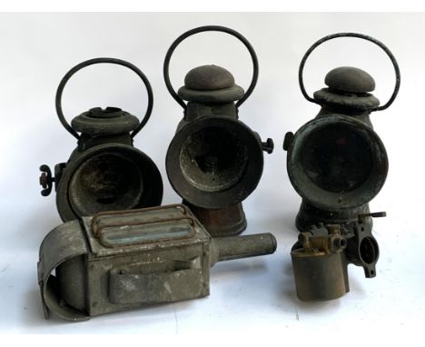Three railway lanterns, a carriage lamp with bevelled glass and an Amal Birmingham vintage carburettor 
