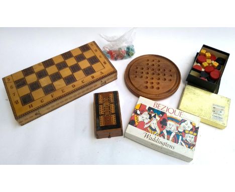 A mixed lot of games to include folding chess board, solitaire board, marquetry cribbage board, bezique etc 