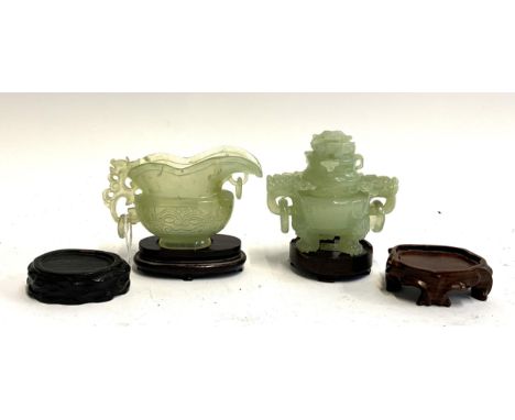A Chinese celadon jade tripod incense burner, 20th century, 9.5cm high; and a Chinese archaistic celadon jade libation cup, 2