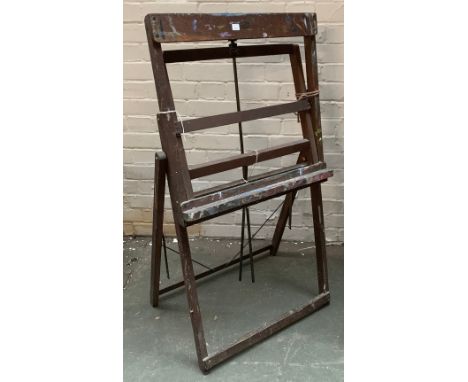 An oak folding artist's easel, bears label for Clifford, Milburn &amp; Co., 55cmW, collapsed height 108cmH 