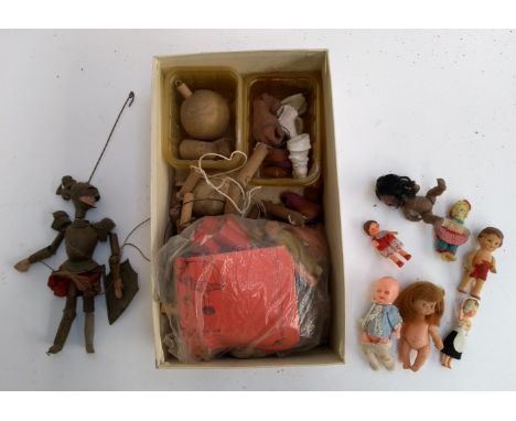 A small puppet of a knight in armour (af); together with a quantity of wooden puppet parts and other vintage dolls 