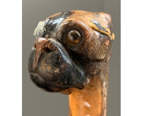 An unusual walking stick, the terminal carved as a pug dog with an eye patch (af)