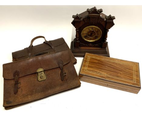A carved American mantel clock (af), marked Ansonia Clock Co. New York, together with two leather briefcases, and a rectangul