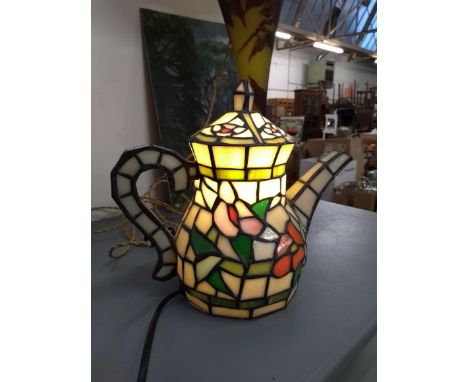 A stained glass lamp in the form of a teapot, 24cmH