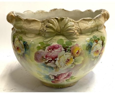 A large glazed ceramic planter with floral decoration, 42.5cmD 