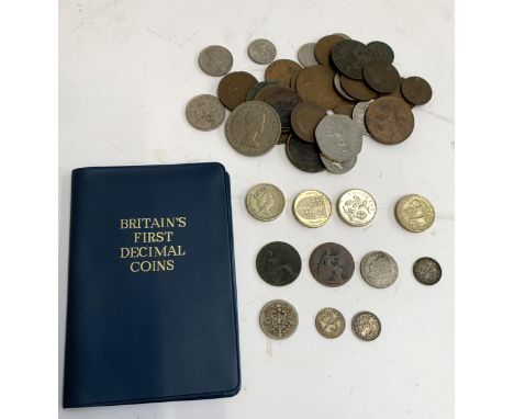 A collection of British and foreign coins to include 10 pfennig 1875, 3 pence coin 1919, 1922 (2), half penny 1898, one pound