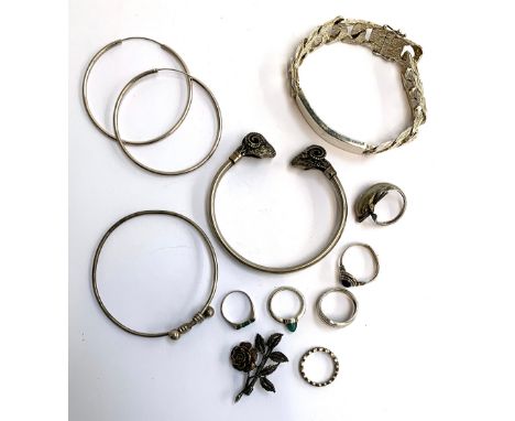 A lot of six silver rings, to include rings set with malachite, lapis lazuli, marcasites etc; a 925 silver bangle with rams h