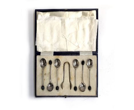 A cased set of six coffee bean terminal spoons, with sugar tongs, by Mappin &amp; Webb, Sheffield 1928