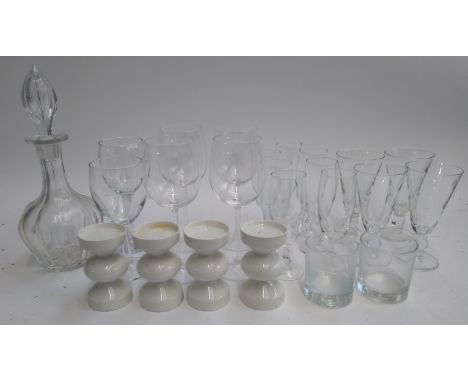 A quantity of glasses to include tumblers and wine glasses; together with four tea light holders and a cut glass decanter,