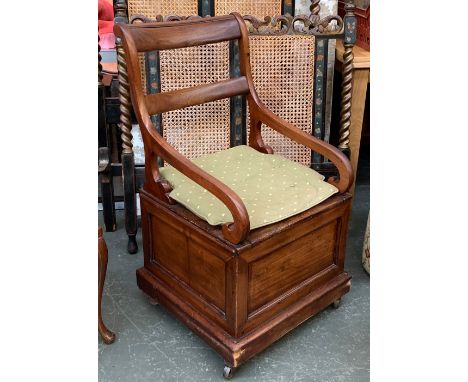 A mahogany commode chair with squab cushion 