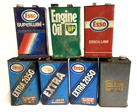 A lot of seven vintage oil cans, to include Esso Superlube; Essolube; BP Engine Oil; Esso Extra 250 etc 