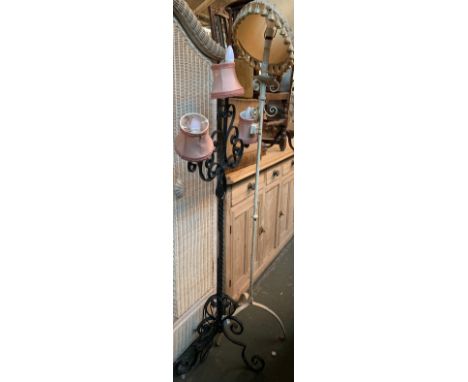 Two wrought iron standard lamps, one with three light fittings 