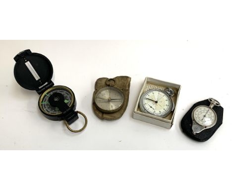 An engineer's directional compass, together with one other compass, a The Yachtsman timer and an opisometer for converting 1/