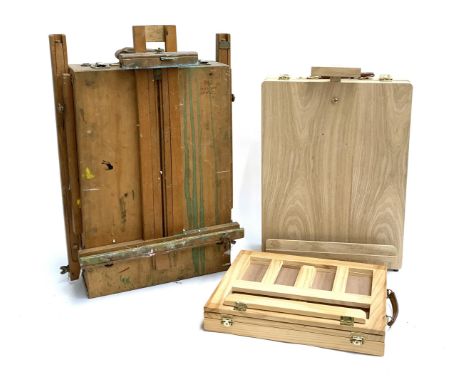 A beechwood folding artists' easel, together with one other tabletop easel in as new condition and one other 