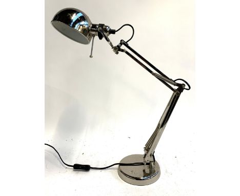 An adjustable chrome desk lamp 