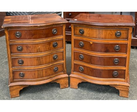 A pair of small serpentine bedside cabinets, each with four drawers, on bracket feet, 43x35x51cmH 