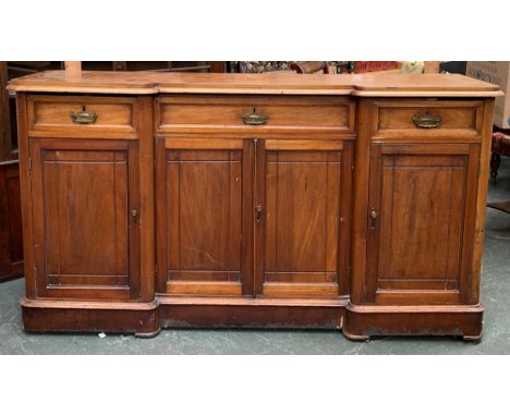 An early 20th century light mahogany breakfront sideboard, three drawers over four cupboard doors, on plinth base, 185x49x100