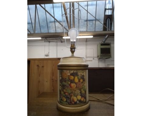 A ceramic table lamp with fruit design, 36cmH; together with one other 