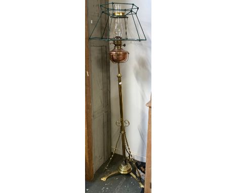 A cathedral style brass and copper oil lamp, 152cmH 