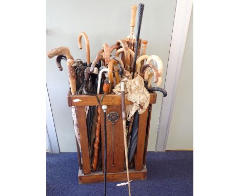 TWO 1930'S DOG'S HEAD HANDLE UMBRELLASthe first an Airedale head of wood (missing eye),the second of a similar breed but of c