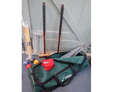 A MODERN 'TITAN' CROQUET SETin a soft case (case dusty and marked from storage, some mouse damage)
